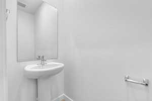 Bathroom featuring baseboards