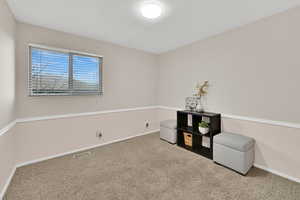 Game room with carpet floors and baseboards