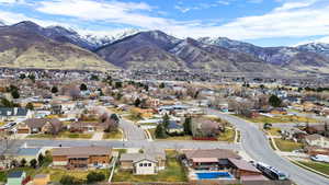 View of property location featuring a mountainous background and nearby suburban area