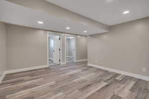 Finished basement featuring recessed lighting and light wood-style floors