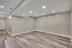 Spare room featuring recessed lighting and light wood-type flooring