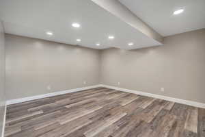 Finished basement with recessed lighting and light wood finished floors