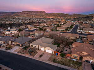 Aerial view at dusk of a residential view and a mountain view