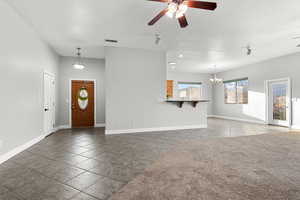 Entryway featuring a ceiling fan, a textured ceiling, and hanging lights
