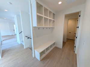 Mudroom with light wood-style floors and recessed lighting