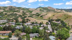 Aerial view of residential area featuring mountains