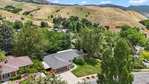 View of subject property featuring a mountain backdrop