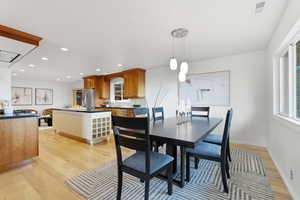 Dining room featuring light wood-style floors and recessed lighting