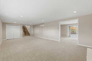 Below grade area with recessed lighting and light carpet