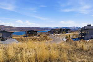 View of mountain backdrop with a nearby body of water