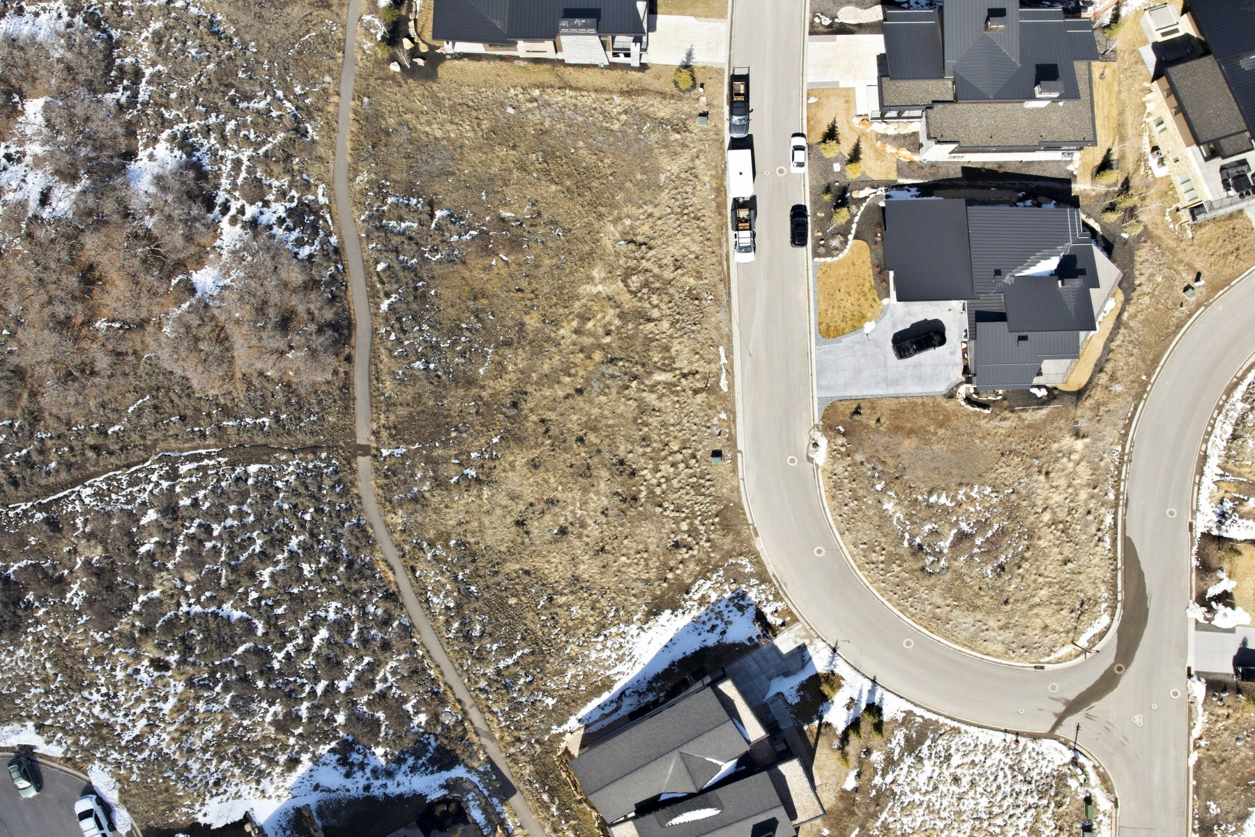 View of property location with nearby suburban area