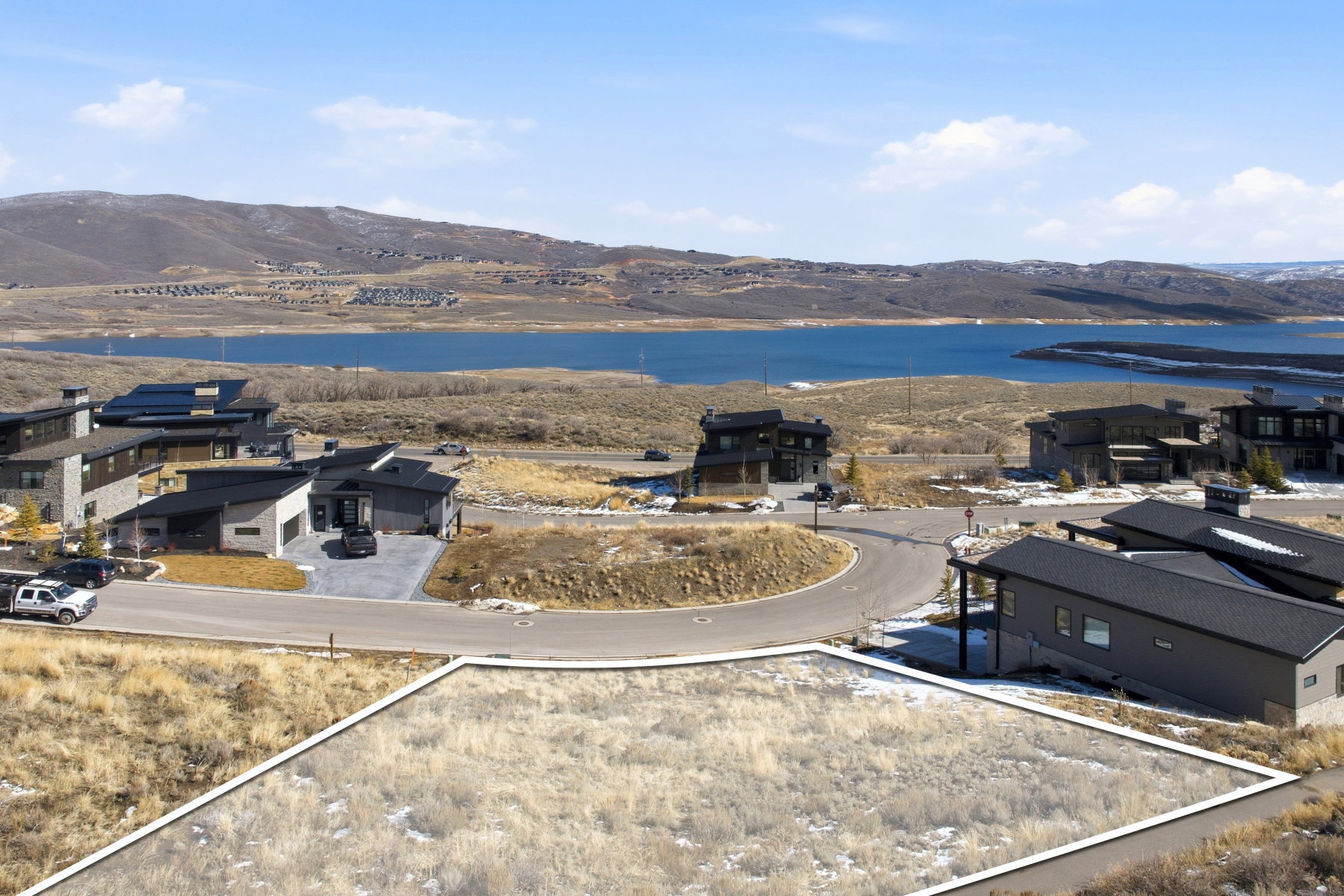 Aerial view of residential area featuring a water and mountain view