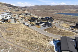 View of property location with mountains and nearby suburban area