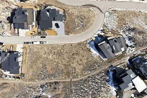 Aerial overview of property's location with nearby suburban area