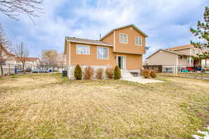 Back of house with a patio area