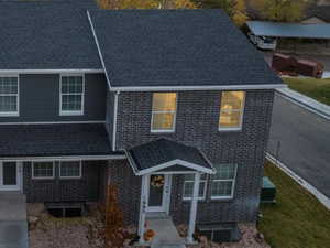 View of front of house with a mountain view and brick siding