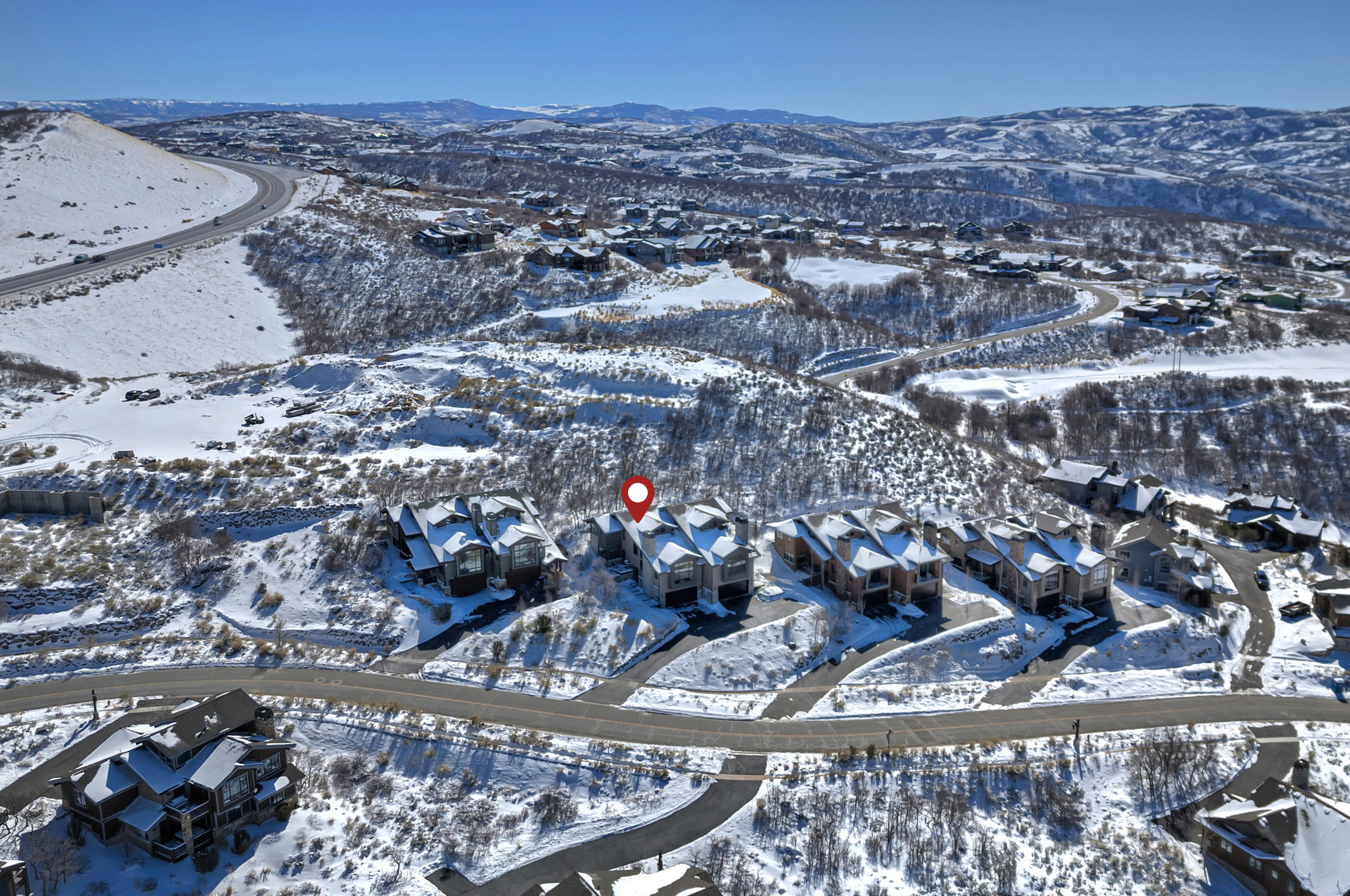 Snowy aerial view with a mountain view