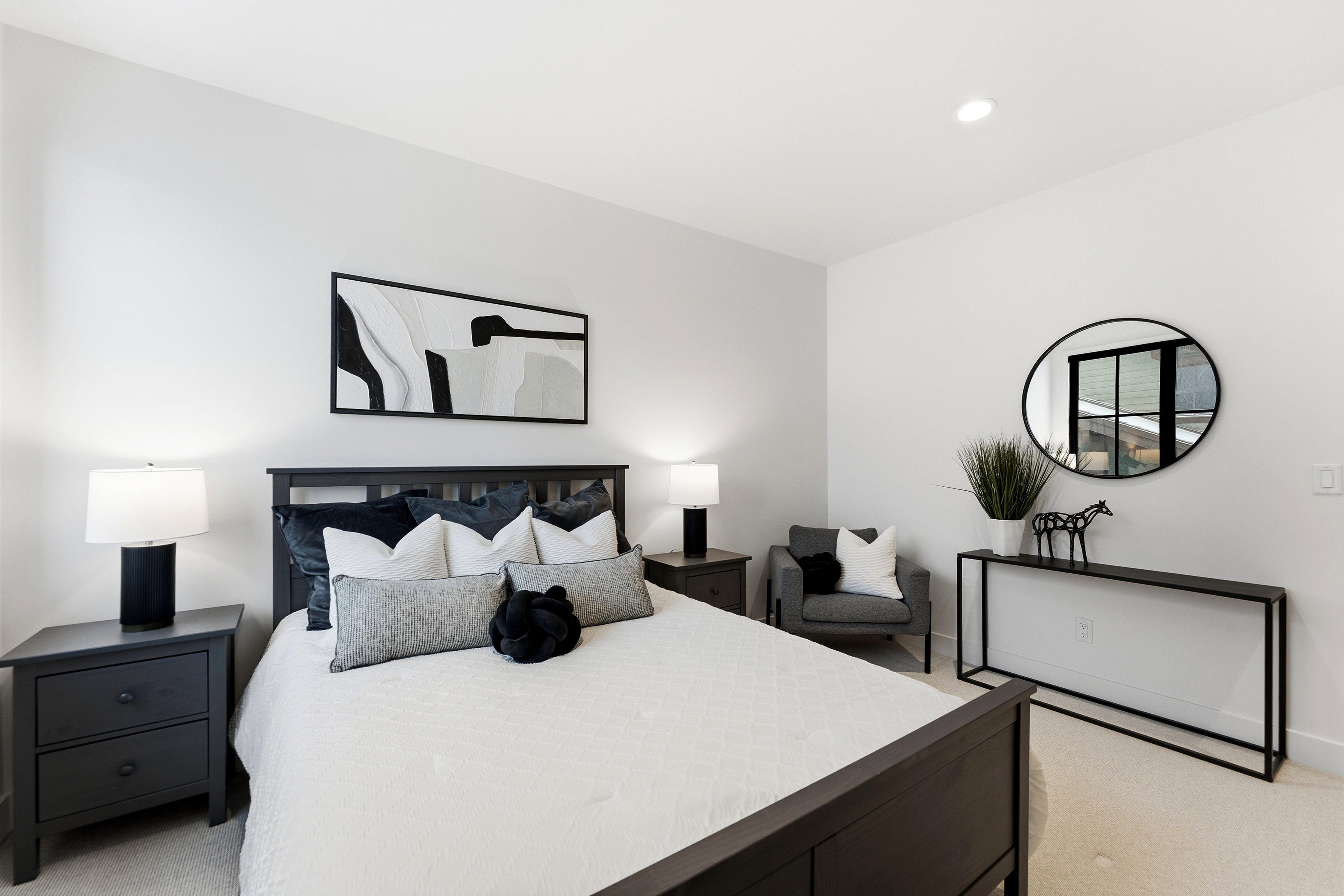 Bedroom with light carpet and recessed lighting