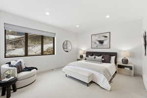 Bedroom featuring light colored carpet and recessed lighting