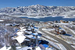 Snowy aerial view featuring a mountain view