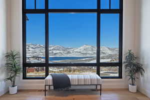 Bedroom with a mountain view and wood-type flooring