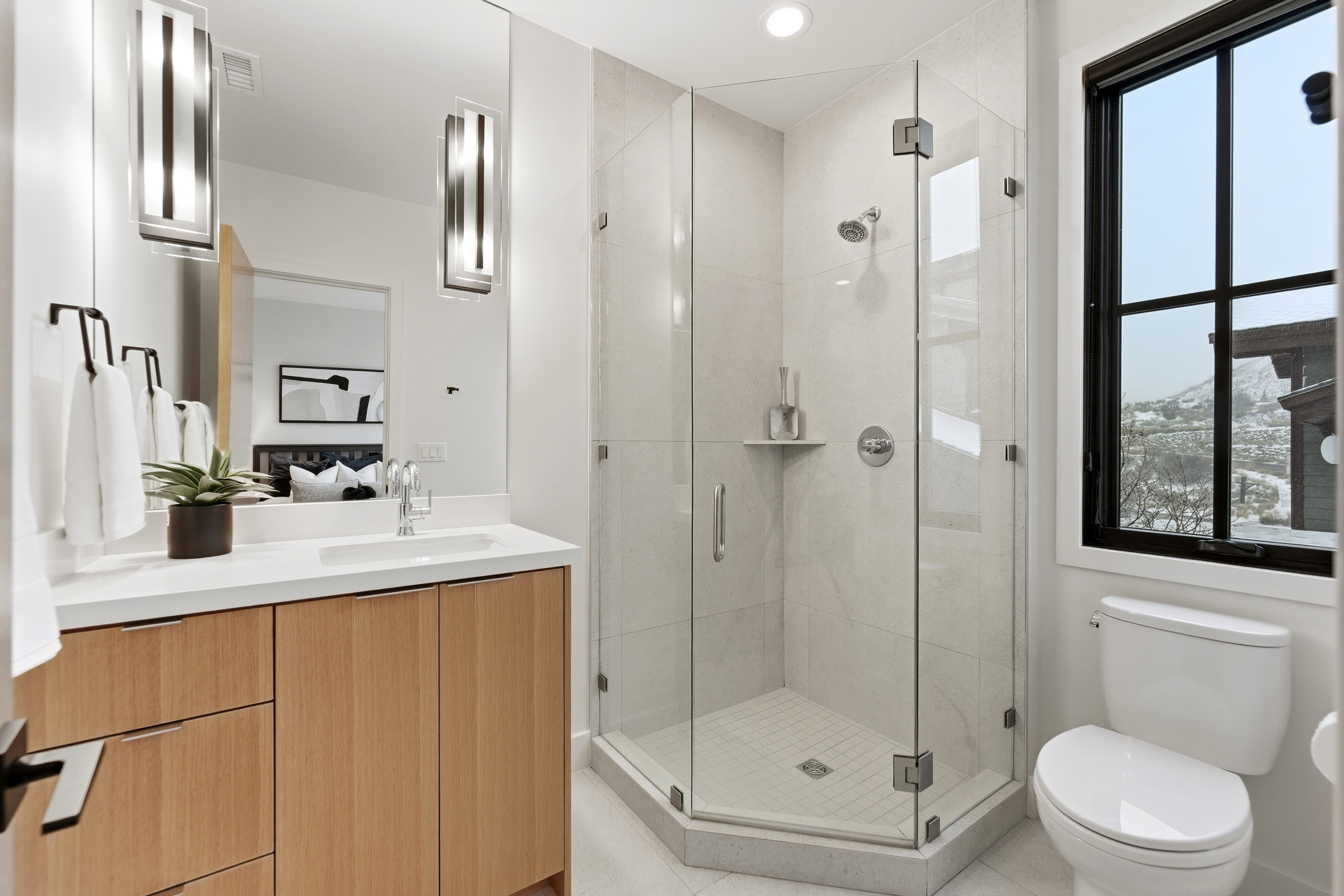 Ensuite bathroom with a shower stall and vanity