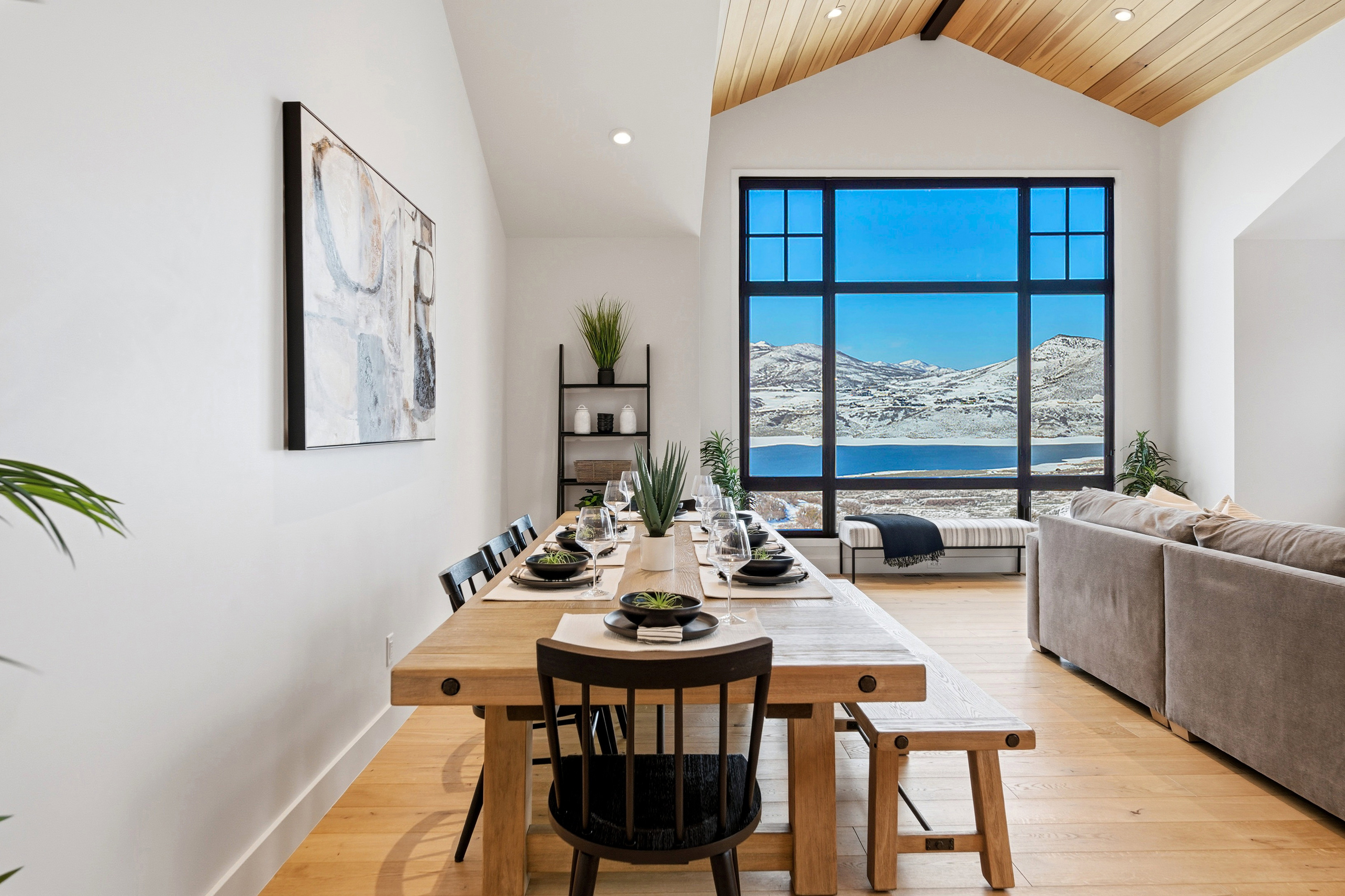 Dining area featuring light wood-type flooring, recessed lighting, a mountain view, and a high ceiling