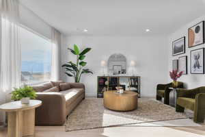 Living area with wood finished floors, recessed lighting, and a mountain view