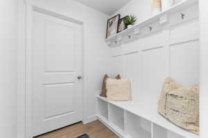 Mudroom featuring light wood-style flooring