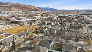 View of property location with a mountainous background and nearby suburban area