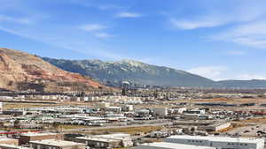 View of mountain backdrop with an industrial area