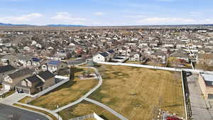 Aerial perspective of suburban area featuring a mountain backdrop
