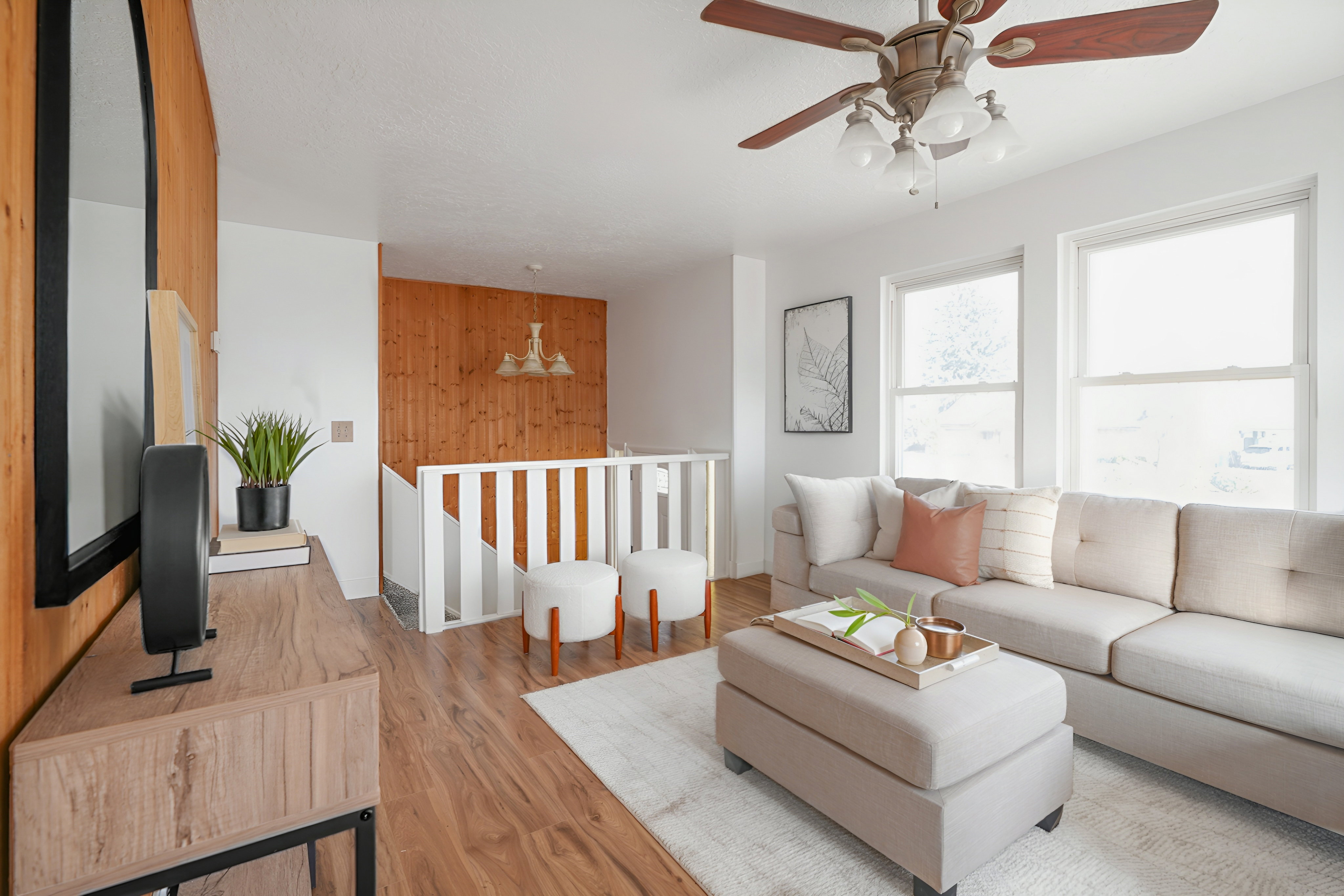 Living room with wood finished floors and ceiling fan