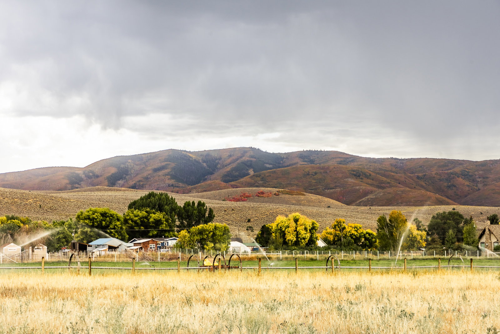 View of mountain background featuring rural landscape