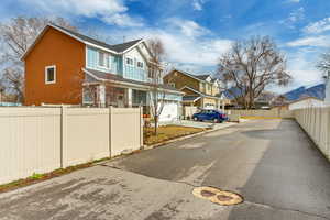 View of asphalt street with a residential view