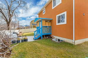 Back of property with stucco siding and a patio