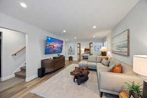 Living room featuring light wood-style floors and recessed lighting