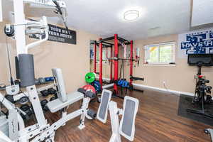 Workout room featuring a textured ceiling