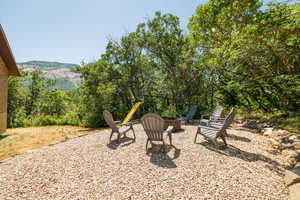 View of yard featuring an outdoor fire pit and a patio