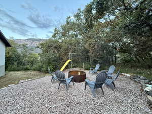 View of yard with a fire pit, a patio area, and a mountain view