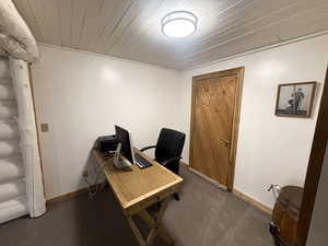 Office space featuring wood ceiling and carpet