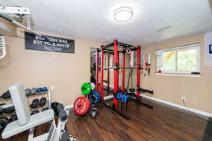 Workout room featuring a textured ceiling