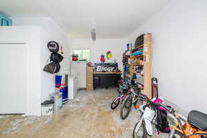 Garage with white fridge