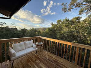 Wooden terrace featuring an outdoor lounge area