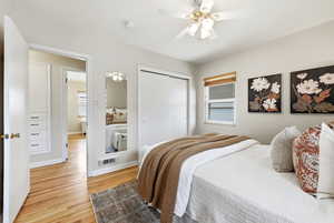 Bedroom with light wood-type flooring, a closet, and ceiling fan