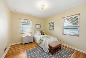 Bedroom featuring light wood-style flooring and baseboards
