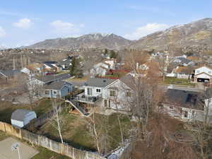 Aerial view of residential area featuring a mountain backdrop
