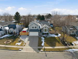 View of front facade featuring driveway and a garage