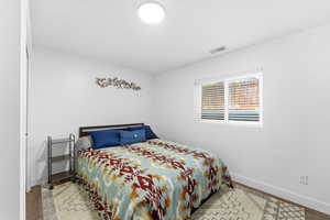 Bedroom with baseboards and light wood-style flooring