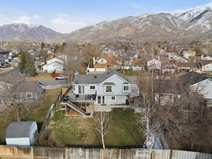 Aerial perspective of suburban area featuring a mountainous background